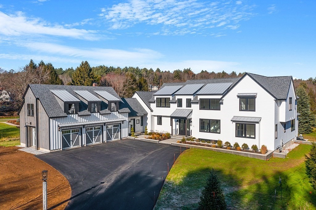 a aerial view of residential houses with yard