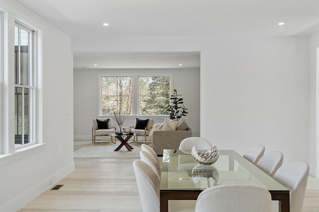 66 Spencer Brook Road Concord, MA 01742 - Photo 13 of 37 a living room with furniture and floor to ceiling windows