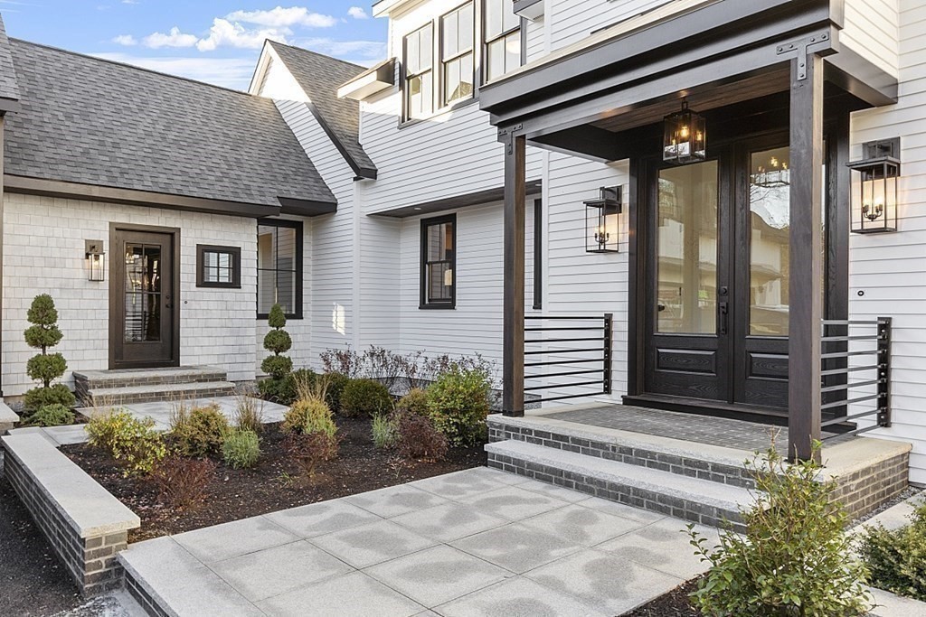 66 Spencer Brook Road Concord, MA 01742 - Photo 3 of 37 a front view of a house with garden