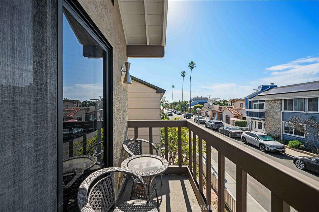86 North Vía Di Roma Walk Long Beach, CA 90803 - Photo 41 of 42 a view of a balcony with chairs and wooden floor