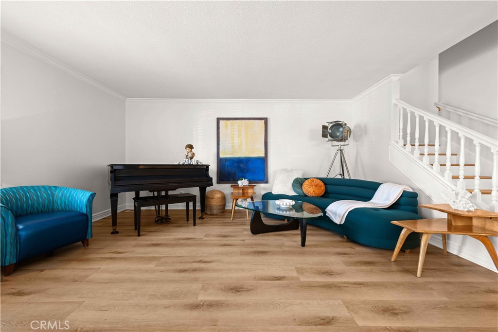 86 North Vía Di Roma Walk Long Beach, CA 90803 - Photo 6 of 42 a living room with furniture and a wooden floor