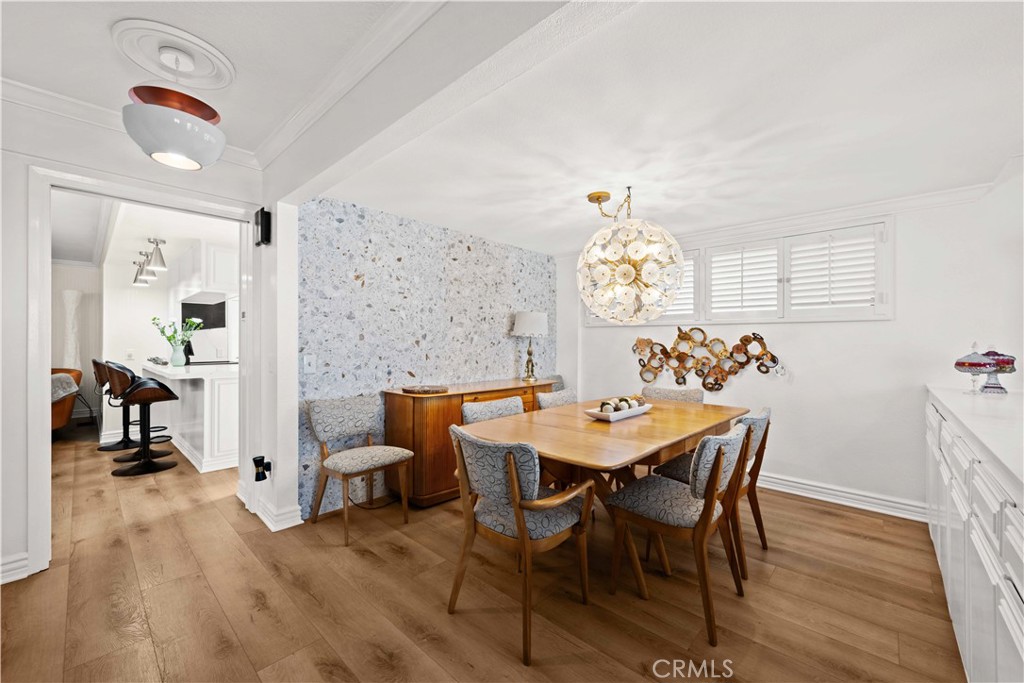 86 North Vía Di Roma Walk Long Beach, CA 90803 - Photo 10 of 42 a view of a dining room with furniture and a chandelier