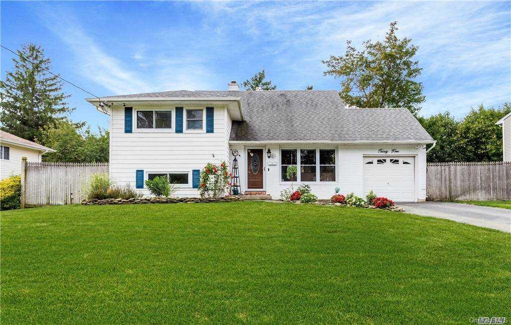 35 Wiltshire Drive Commack, NY 11725 - Photo 1 of 1 a view of a house with a yard and sitting area