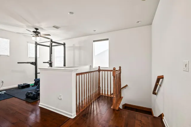 a view of entryway with wooden floor and stairs