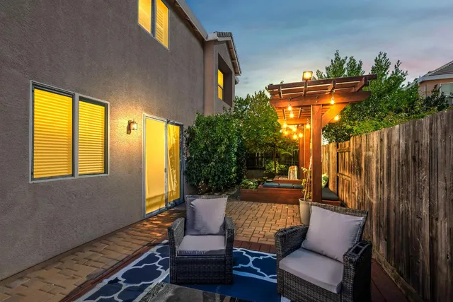a outdoor living space with furniture and a potted plant