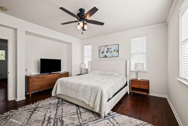 a bedroom with a bed and a tv