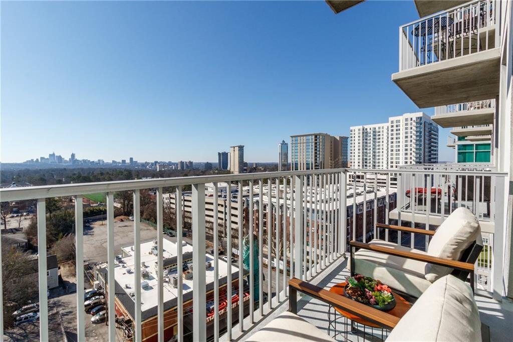 250 Pharr Road Northeast, Unit 1116 Atlanta, GA 30305 - Photo 26 of 45 a view of a balcony with two chairs and a table