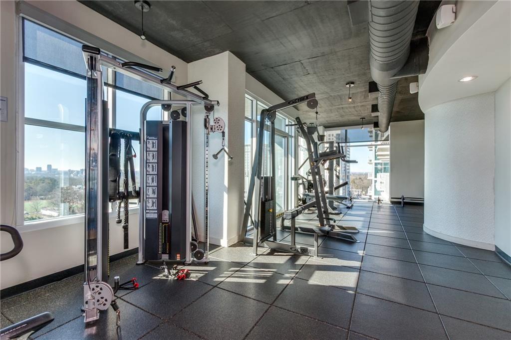 250 Pharr Road Northeast, Unit 1116 Atlanta, GA 30305 - Photo 29 of 45 a view of a room with gym equipment