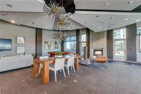 a view of a swimming pool with outdoor seating