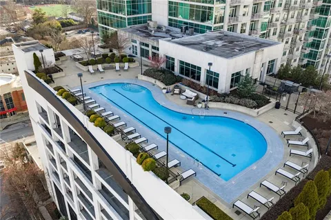 a room with table chairs and wooden floor