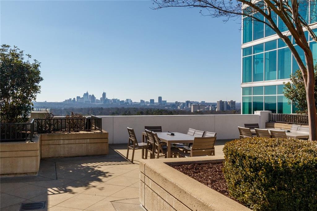 250 Pharr Road Northeast, Unit 1116 Atlanta, GA 30305 - Photo 45 of 45 a view of a terrace with furniture