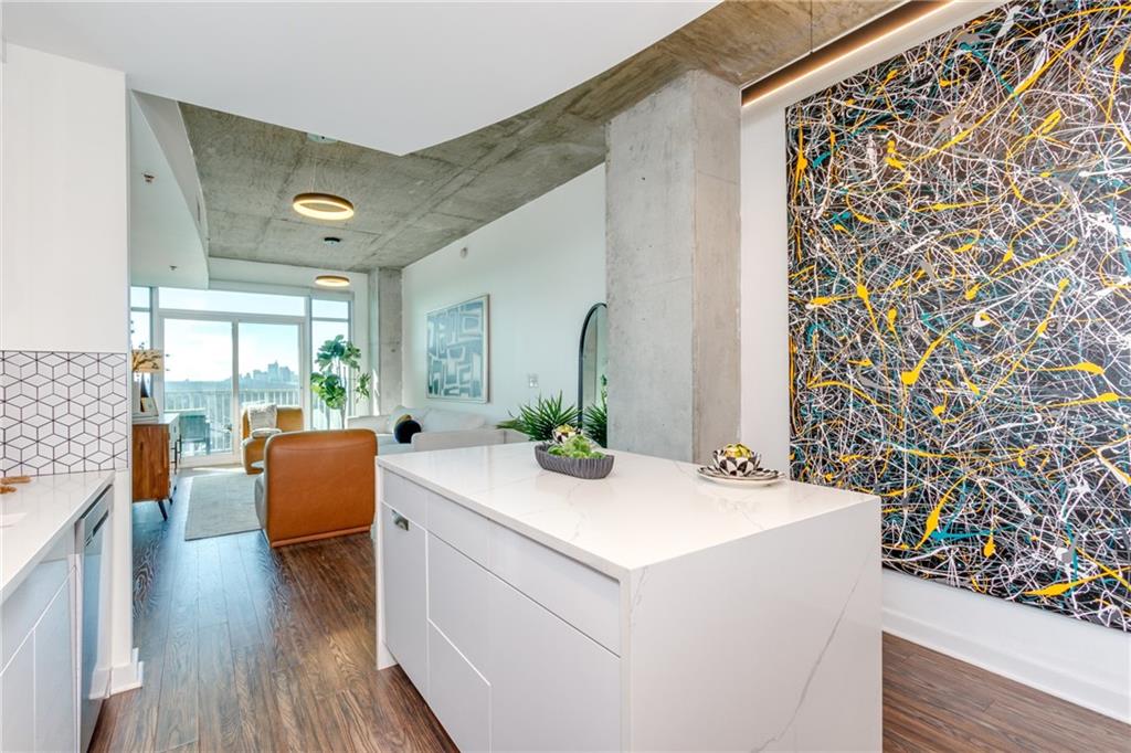 250 Pharr Road Northeast, Unit 1116 Atlanta, GA 30305 - Photo 5 of 45 a view of living room with furniture and wooden floor