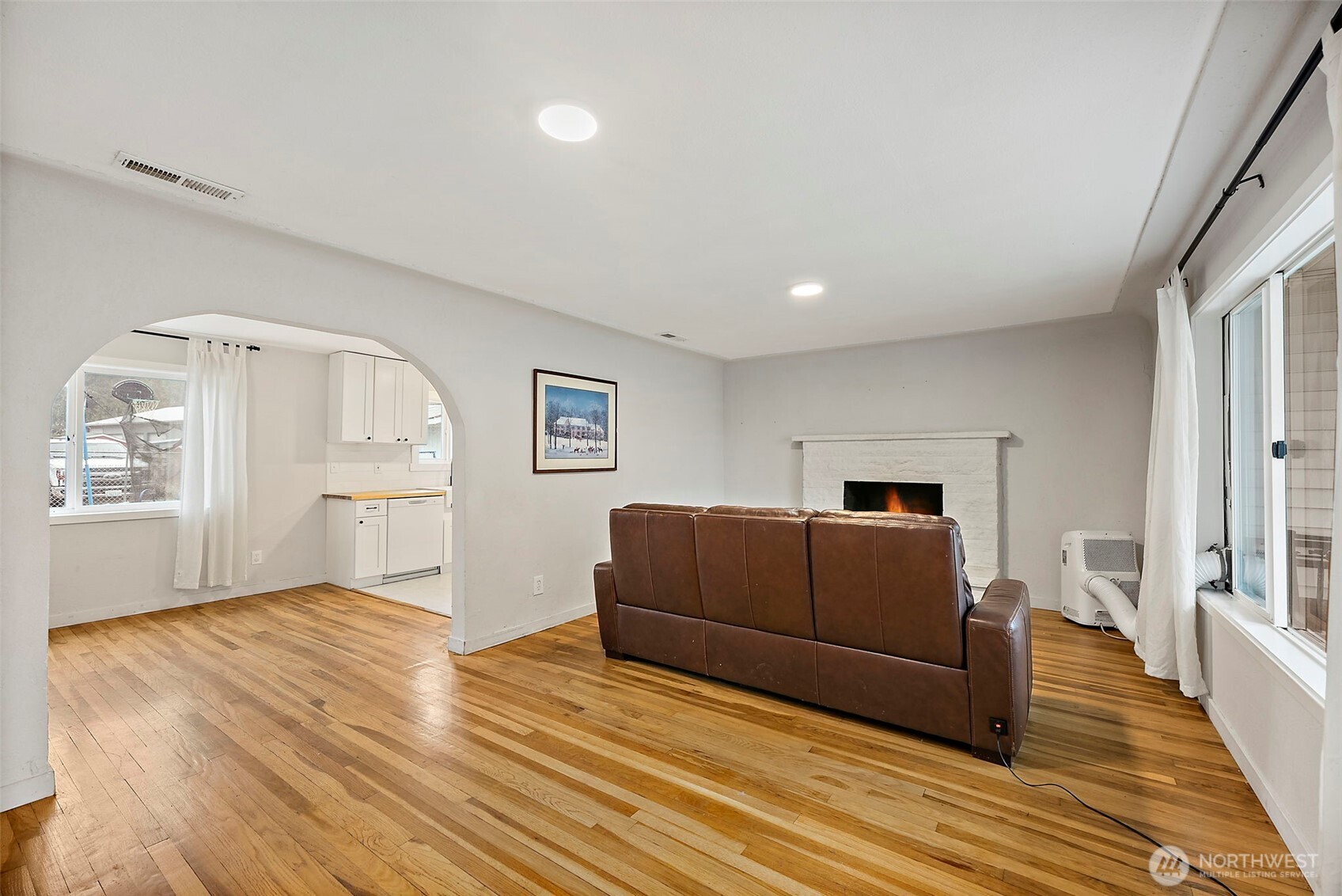 2949 South Bay Road Northeast Olympia, WA 98506 - Photo 11 of 29 a living room with furniture and a wooden floor