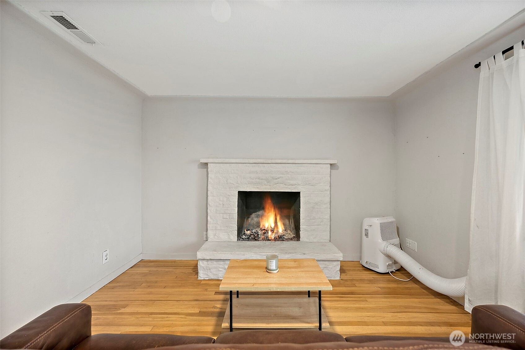 2949 South Bay Road Northeast Olympia, WA 98506 - Photo 12 of 29 a living room with furniture and a fireplace