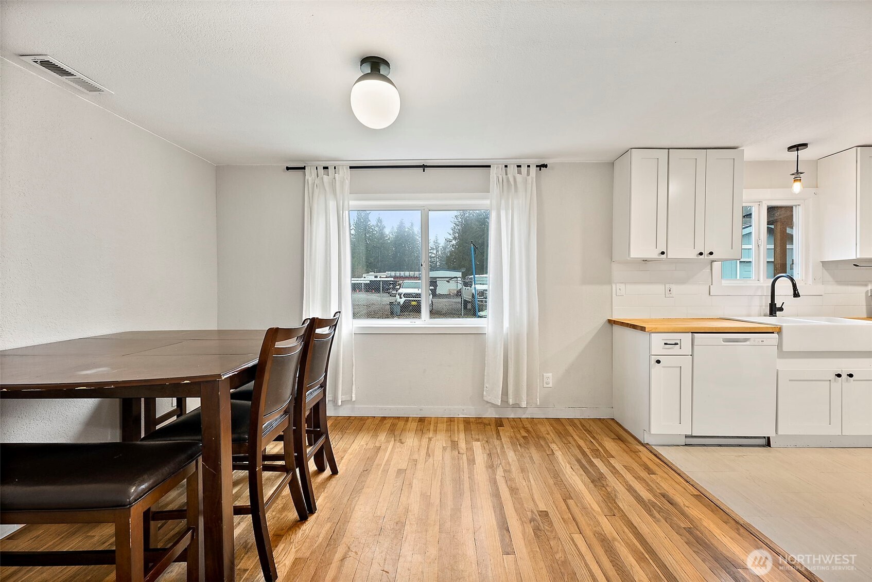 2949 South Bay Road Northeast Olympia, WA 98506 - Photo 15 of 29 a kitchen with granite countertop white cabinets and stainless steel appliances