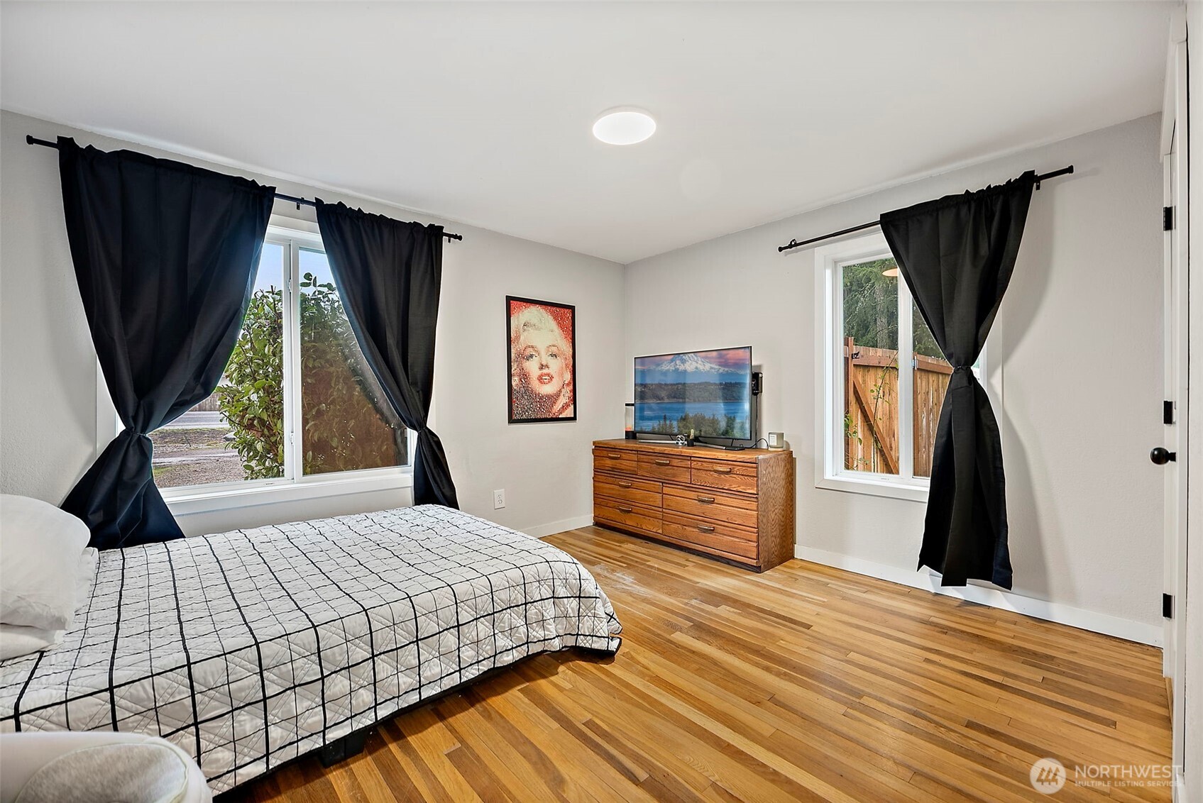 2949 South Bay Road Northeast Olympia, WA 98506 - Photo 23 of 29 a bedroom with a bed and a dresser next to a window