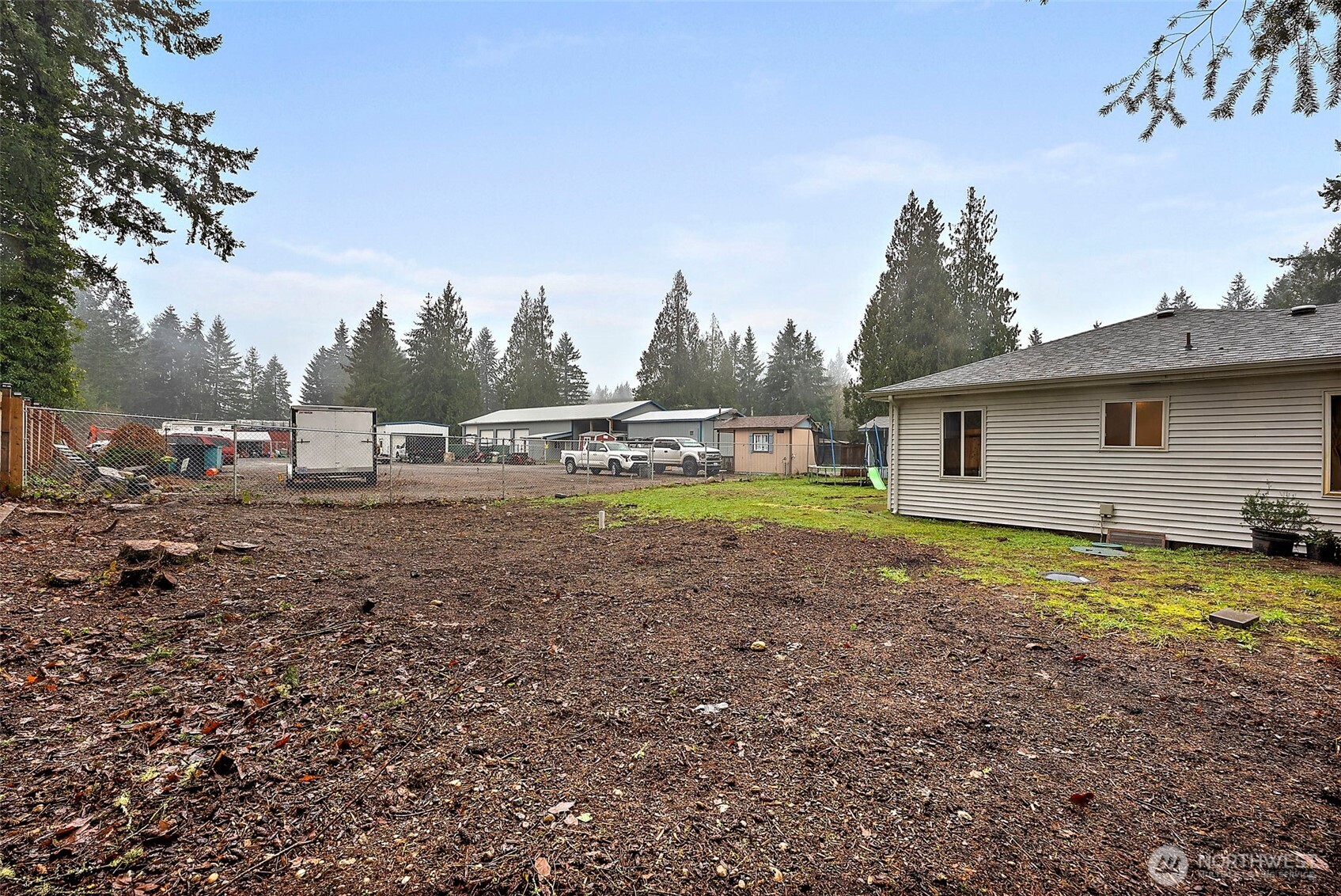 2949 South Bay Road Northeast Olympia, WA 98506 - Photo 7 of 29 a view of a house with backyard and trees