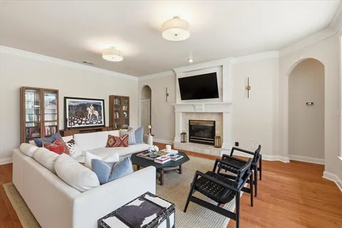 a living room with furniture fireplace and a flat screen tv
