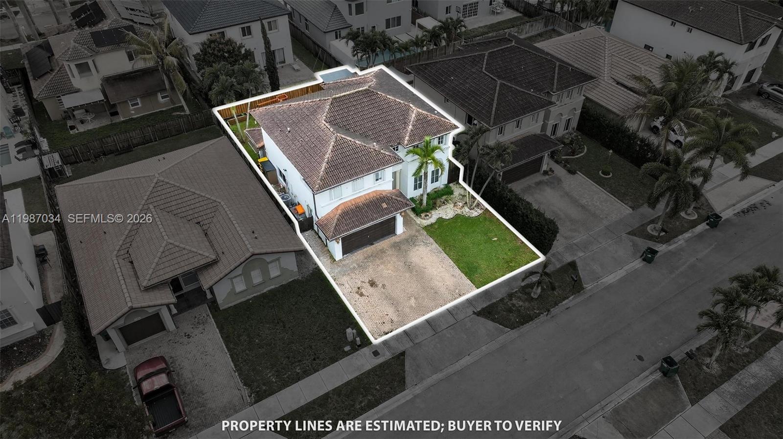 15874 Southwest 138th Terrace, Unit 1 Miami, FL 33196 - Photo 2 of 12 an aerial view of backyard with outdoor kitchen