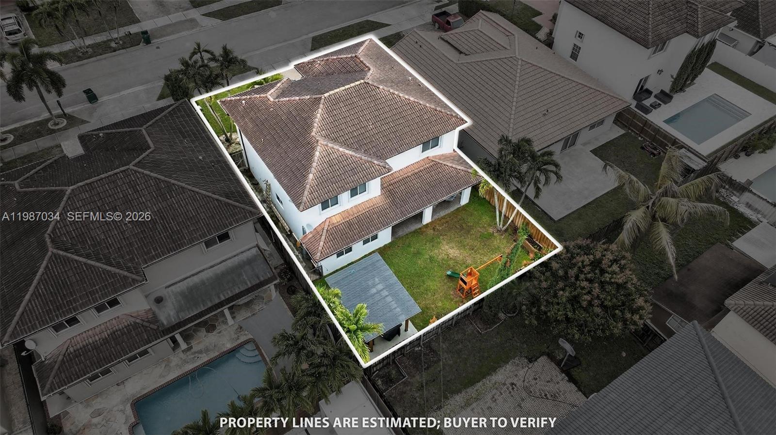 15874 Southwest 138th Terrace, Unit 1 Miami, FL 33196 - Photo 3 of 12 an aerial view of a backyard