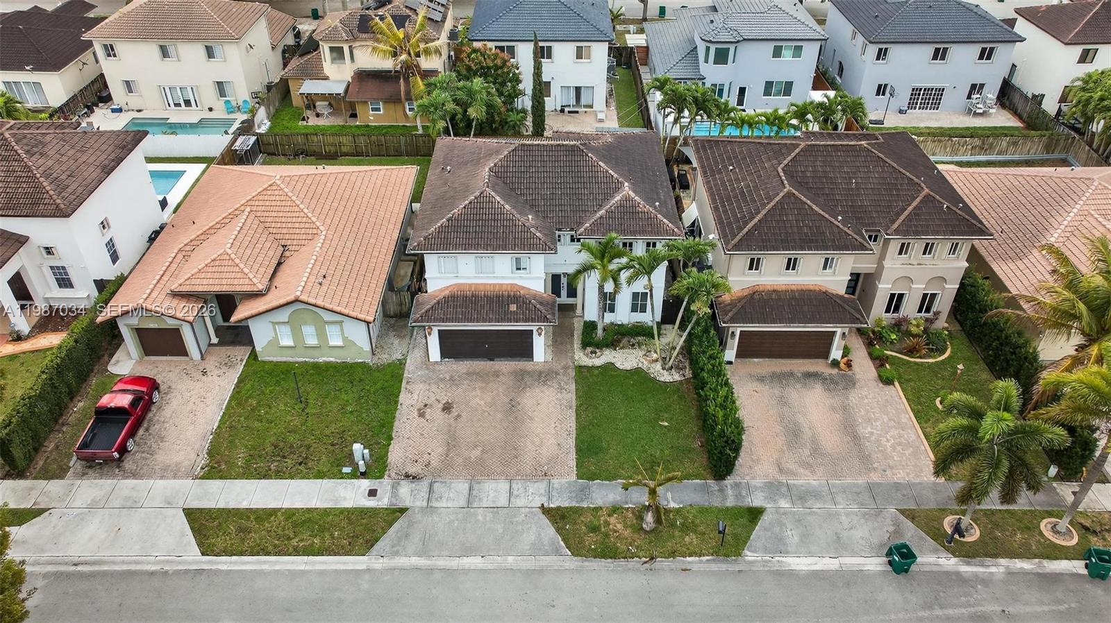 15874 Southwest 138th Terrace, Unit 1 Miami, FL 33196 - Photo 4 of 12 an aerial view of a house with swimming pool