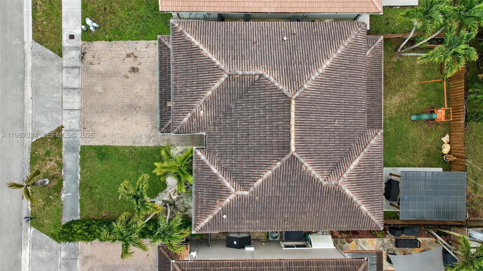 15874 Southwest 138th Terrace, Unit 1 Miami, FL 33196 - Photo 6 of 12 an aerial view of residential houses with outdoor space