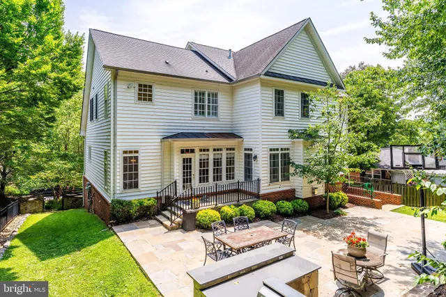 a view of a house with sitting area and garden