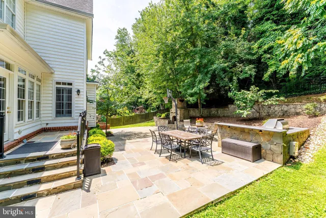a spacious bedroom with a bed and ceiling fan