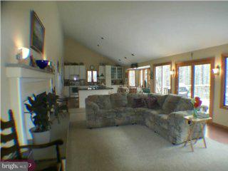 605 Bobbin Mill Road Media, PA 19063 - Photo 2 of 5 a living room with furniture and a fireplace