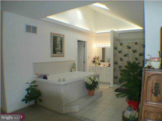 605 Bobbin Mill Road Media, PA 19063 - Photo 4 of 5 a bath room with a sink and a mirror