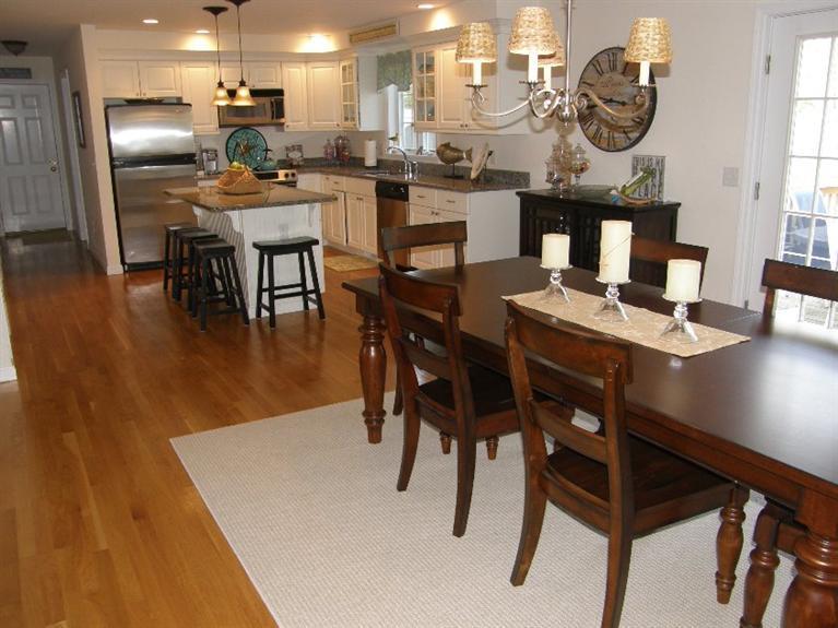 9 Shady Lane Chatham, MA 02633 - Photo 5 of 15 a kitchen with a table chairs and a dining table