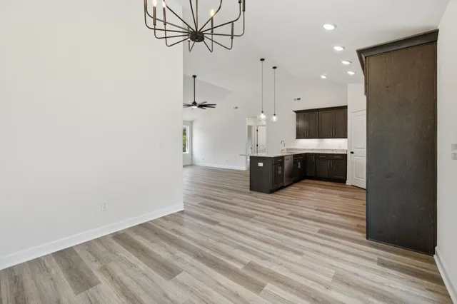a view of kitchen and livingroom with wooden floor