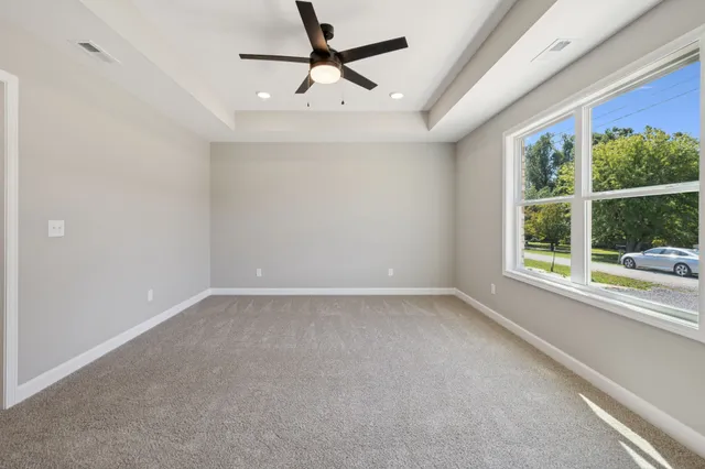 a view of an empty room with a window