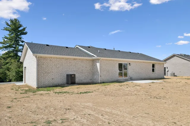 a house with trees in the background