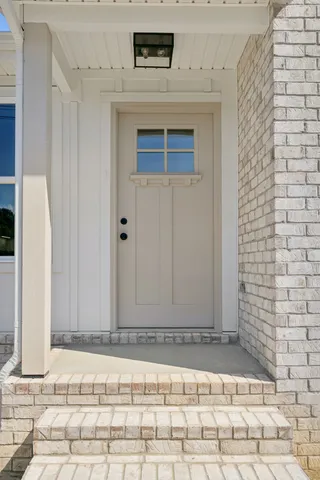 a view of a door with wooden wall