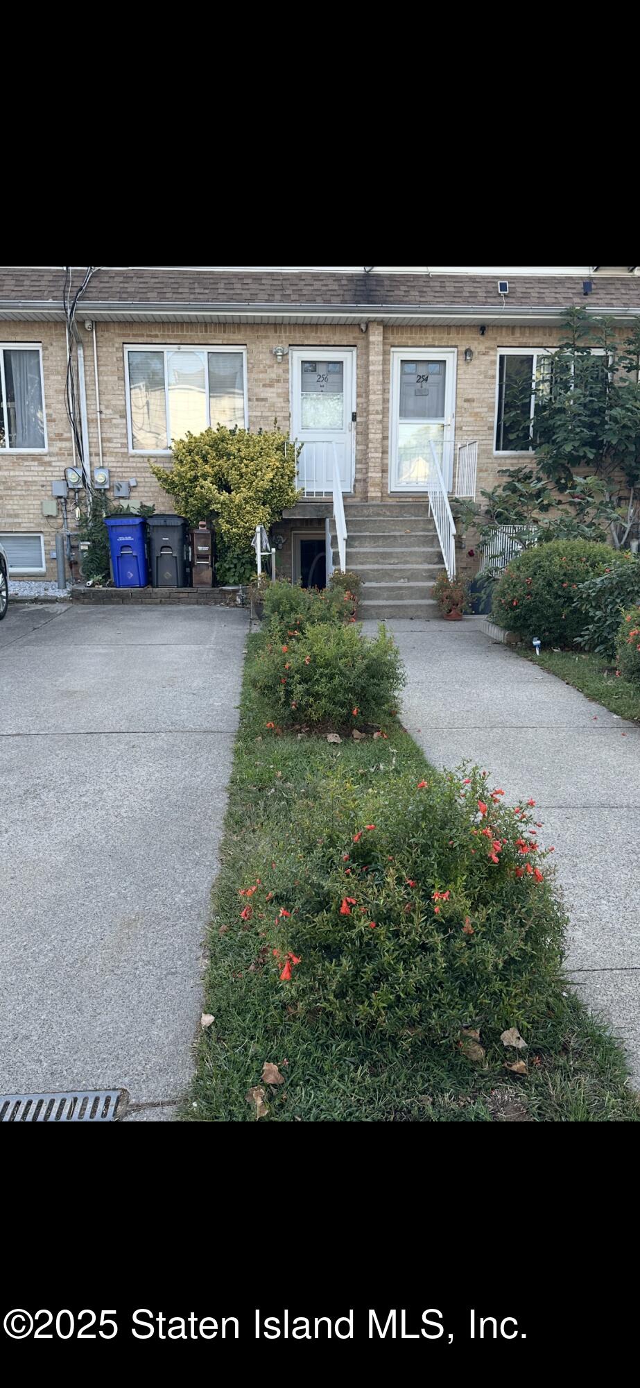256 Maple Parkway Staten Island, NY 10303 - Photo 2 of 21 a front view of a house with garden