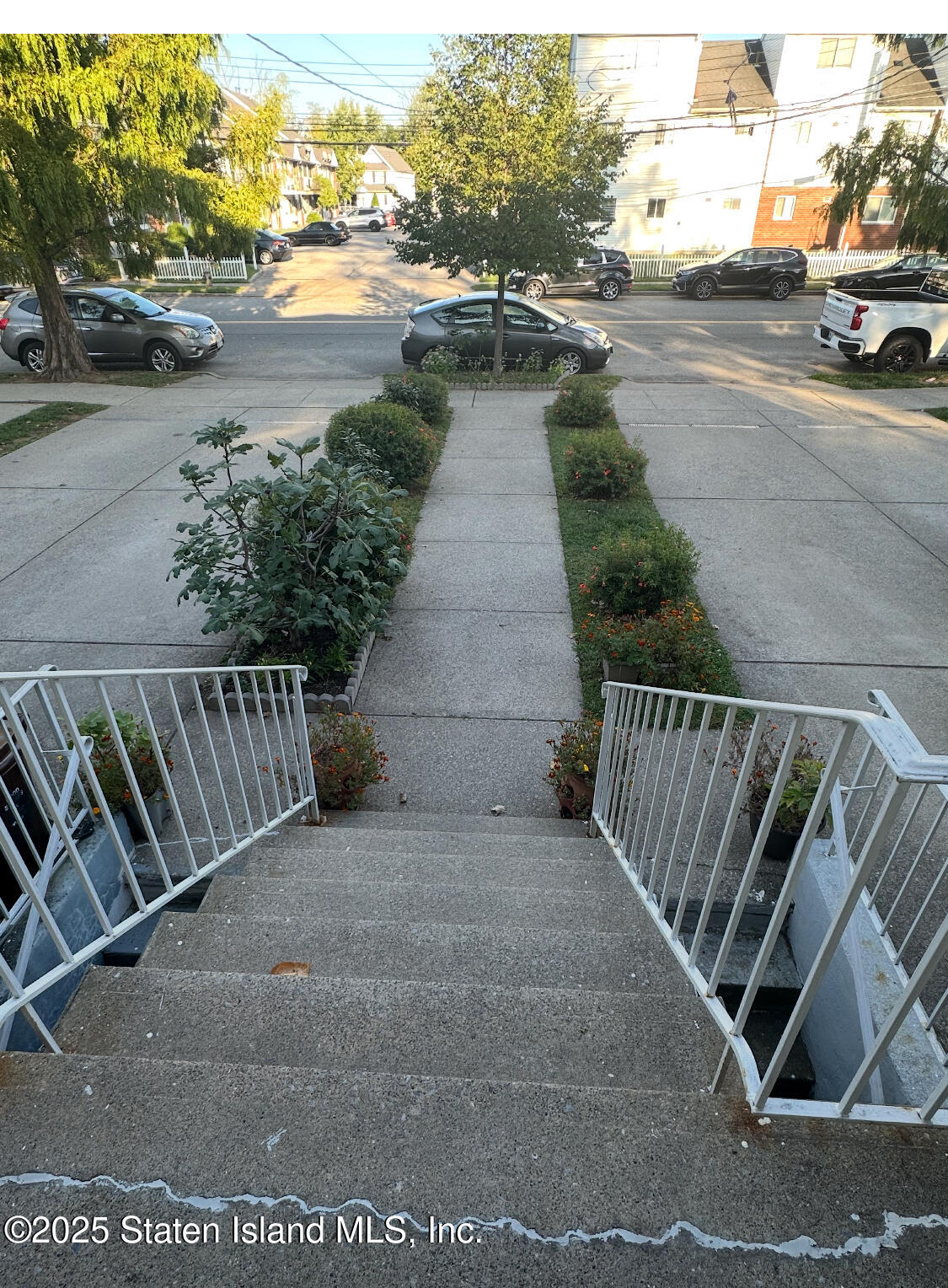 256 Maple Parkway Staten Island, NY 10303 - Photo 5 of 21 a view of a street with cars parked