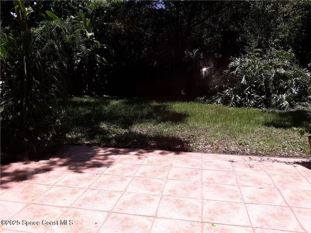 a view of backyard with green space