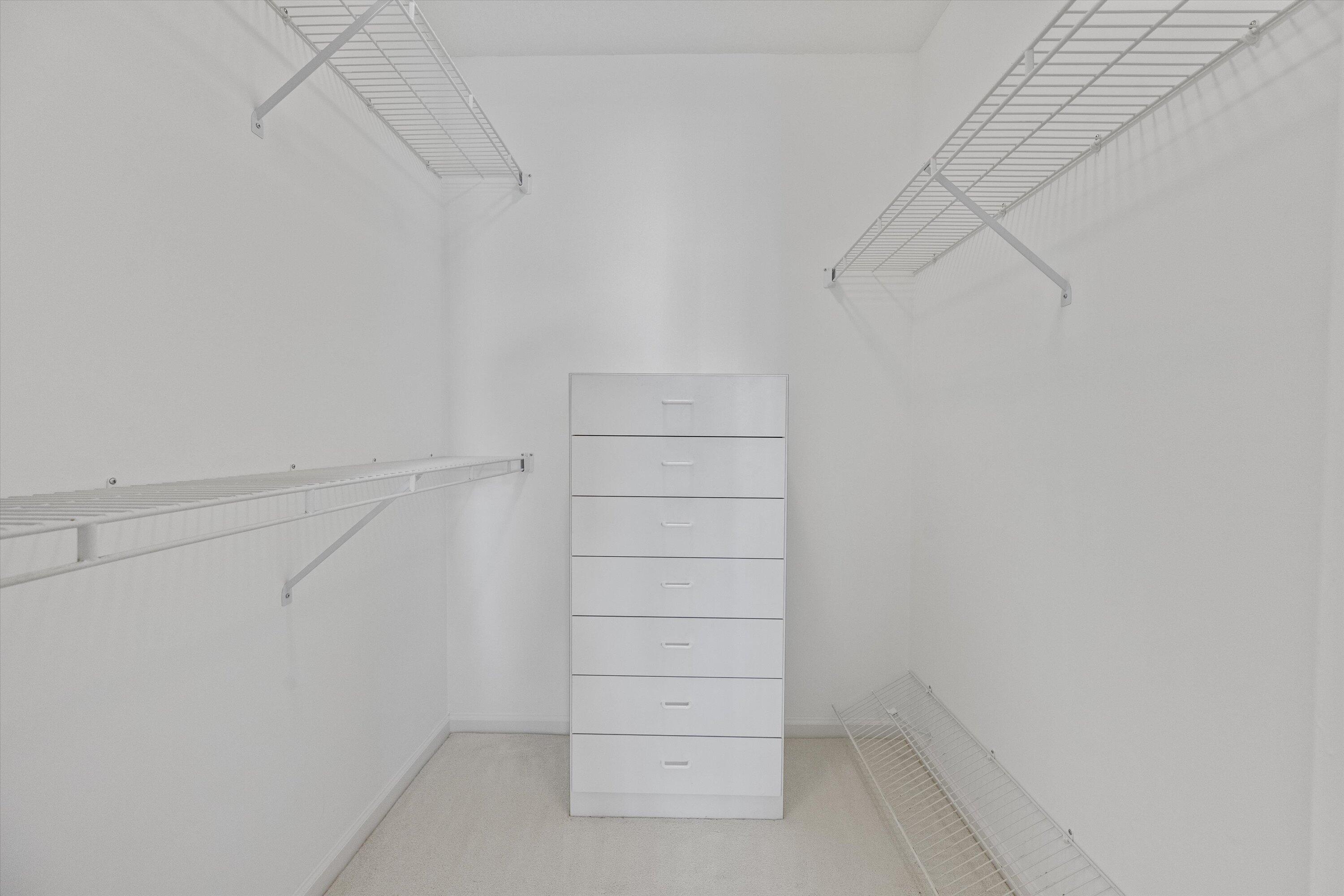 3971 Schooner Pointe Drive, Unit 201 Jupiter, FL 33477 - Photo 28 of 44 a view of walk in closet