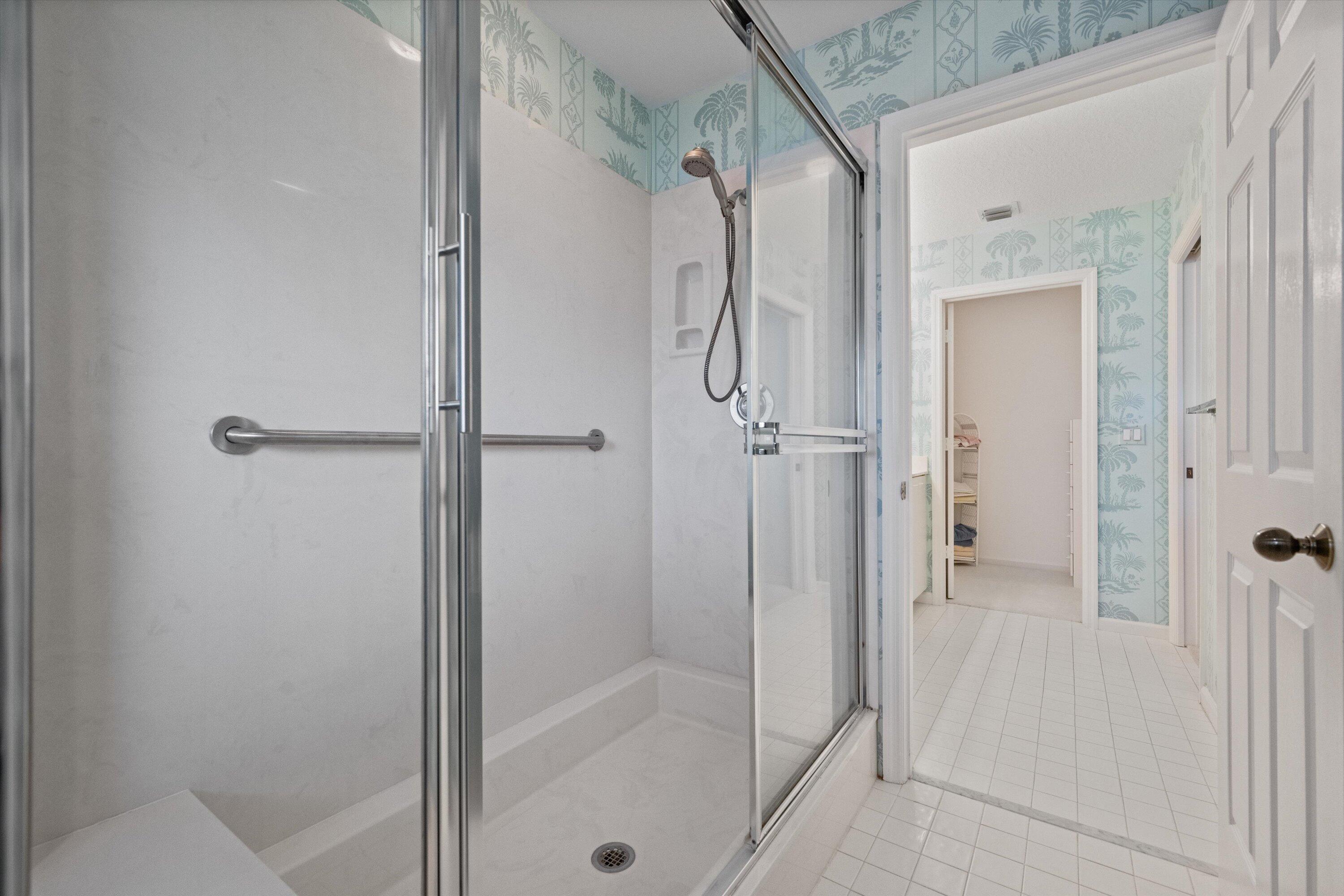 3971 Schooner Pointe Drive, Unit 201 Jupiter, FL 33477 - Photo 31 of 44 a bathroom with a shower