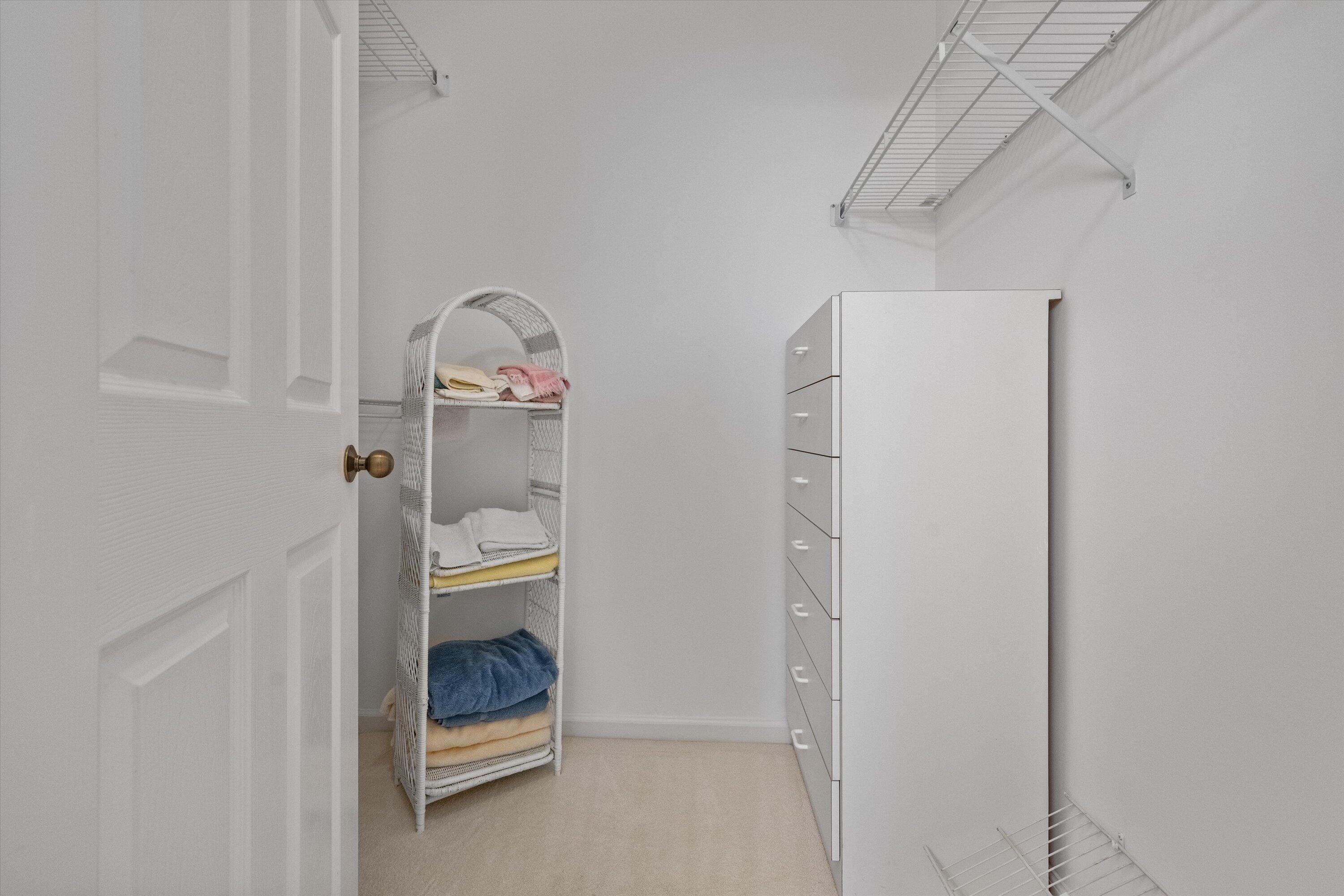 3971 Schooner Pointe Drive, Unit 201 Jupiter, FL 33477 - Photo 32 of 44 a room filled with furniture and white walls