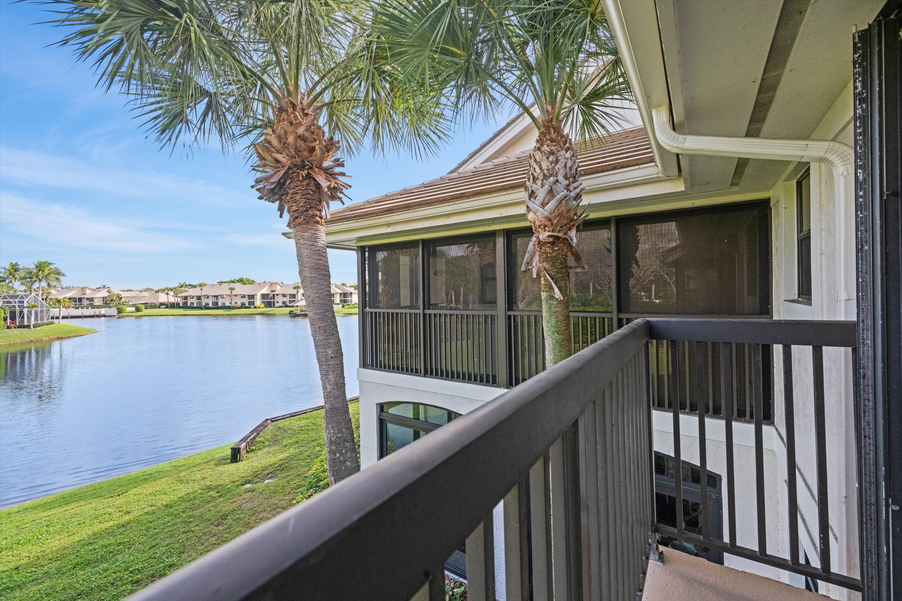 3971 Schooner Pointe Drive, Unit 201 Jupiter, FL 33477 - Photo 38 of 44 a view of outdoor space with deck and a lake view