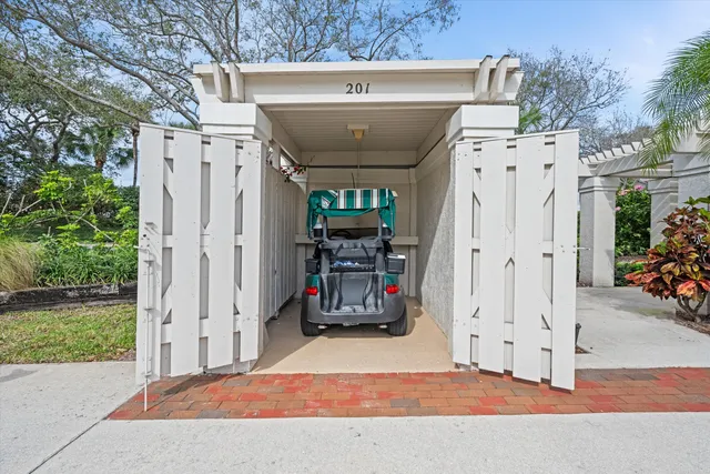 a view of swimming pool with outdoor seating and a garden