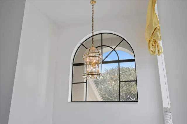 a living room with furniture and a lamp