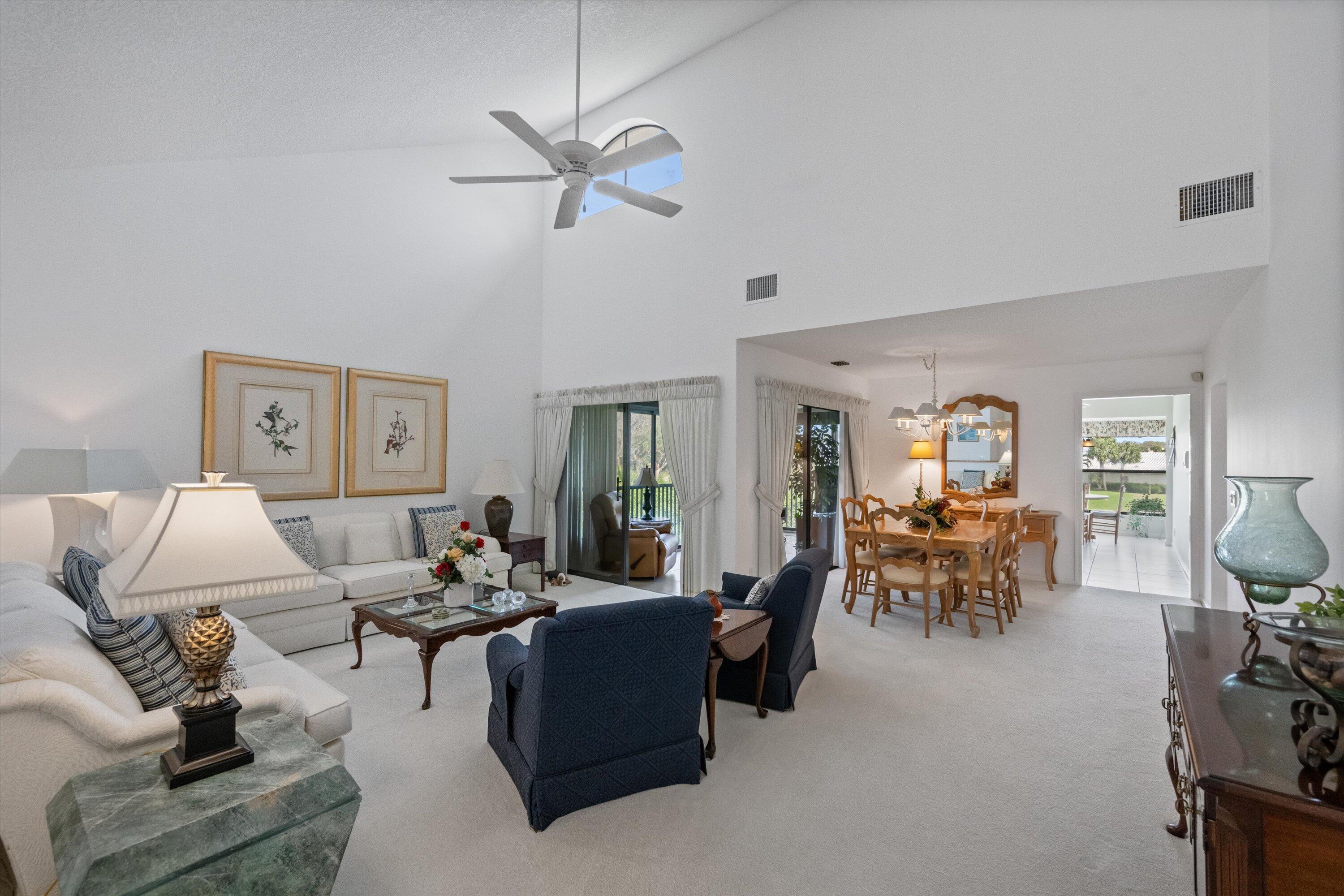3971 Schooner Pointe Drive, Unit 201 Jupiter, FL 33477 - Photo 9 of 44 a living room with furniture