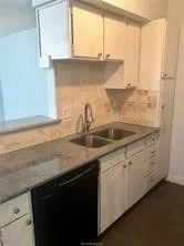 a kitchen with a sink and a window