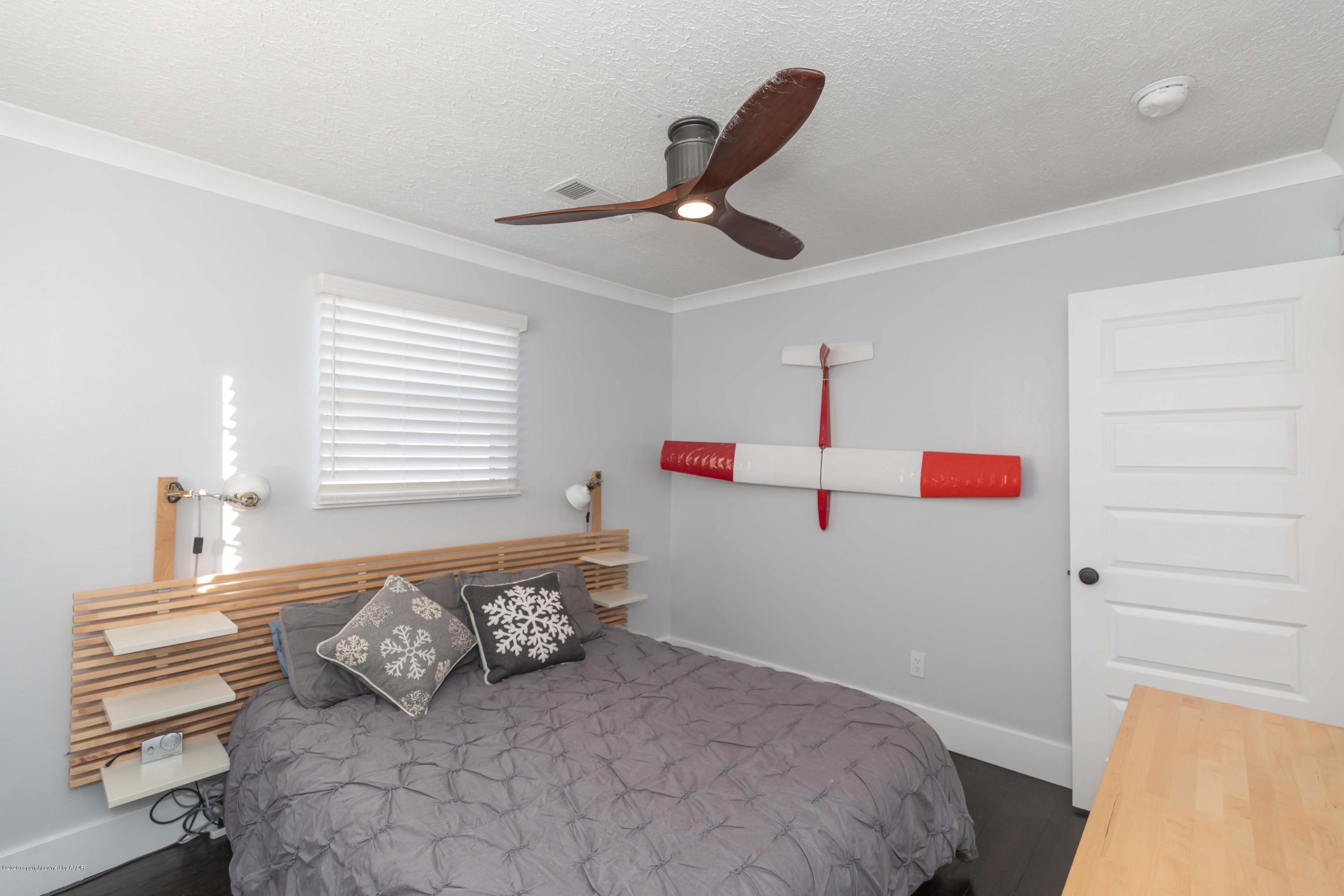 4603 South Lipscomb Street Amarillo, TX 79110 - Photo 17 of 27 a bedroom with a bed and a window