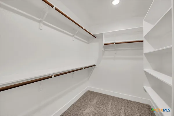 a view of an empty walk in closet