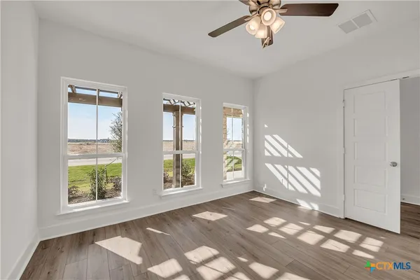 a view of an empty room with a window