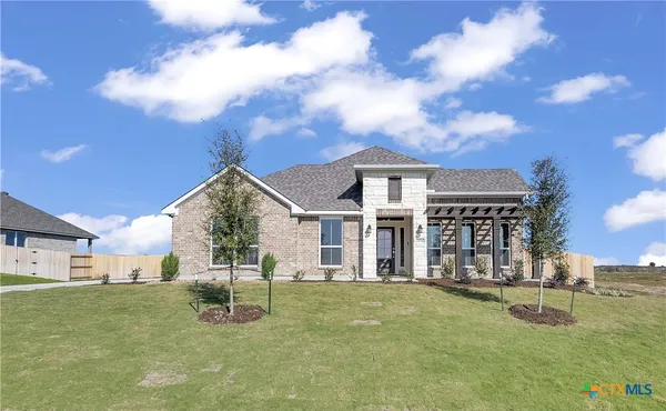 a view of a house with swimming pool and sitting area